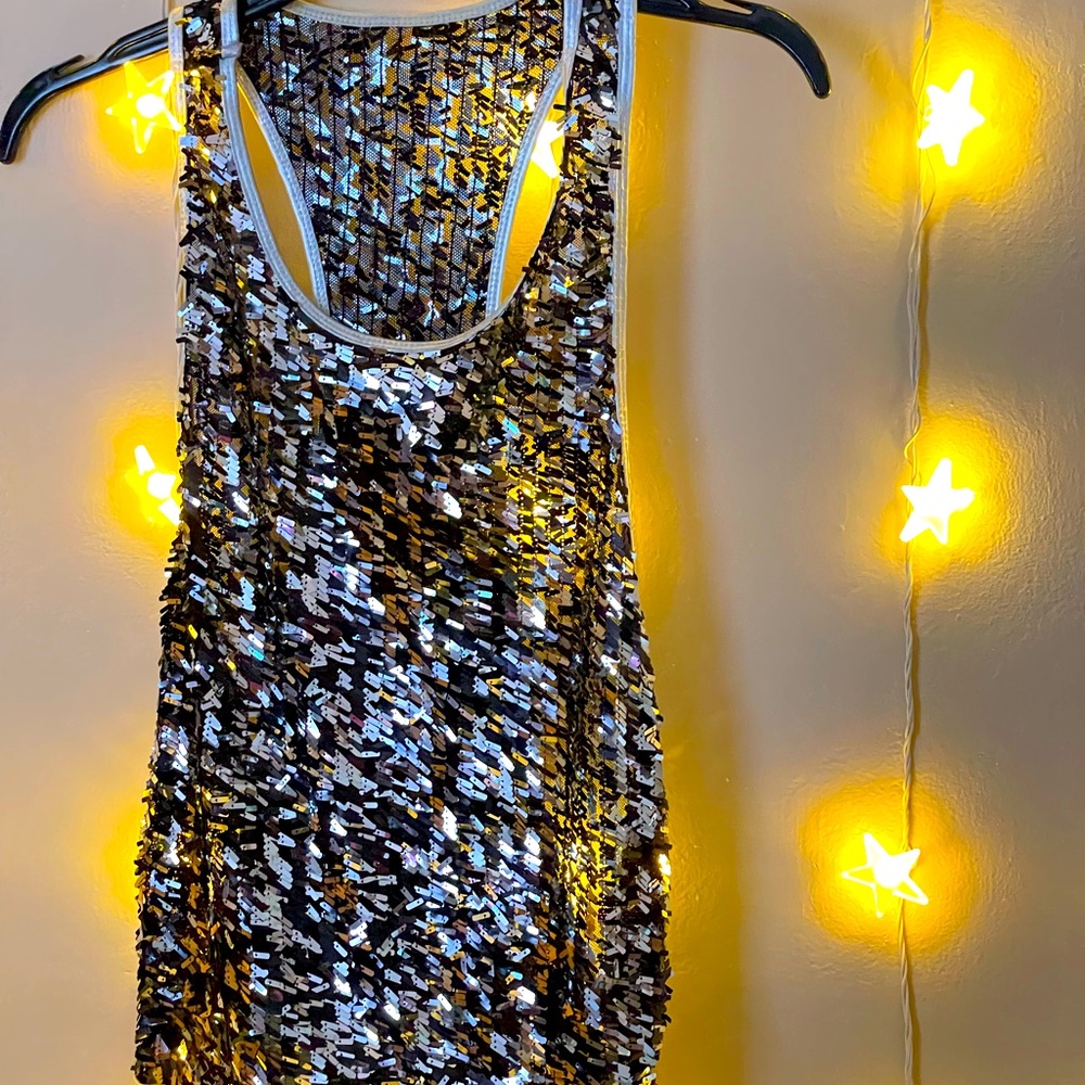 Beautiful gray color sequin tank top.  Excellent condition.